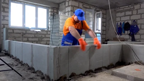 Builder worker breaks part of the wall Stock Footage 115418561