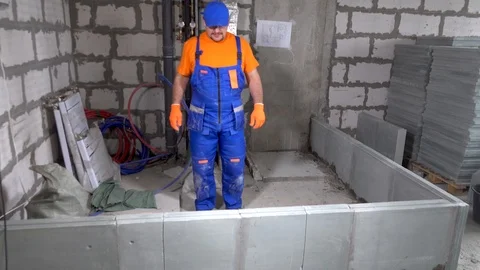 Builder worker breaks part of the wall Stock Footage 115419086