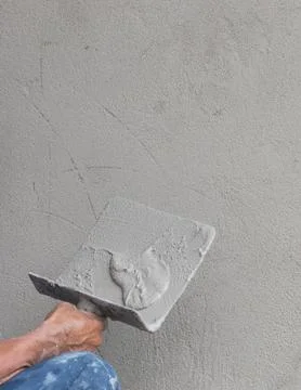 Builder worker plastering concrete Stock Photos