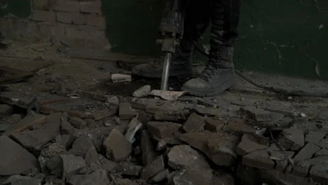 Builder worker with pneumatic hammer drill jackhammer equipment breaking Stock Footage 164284199