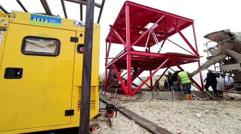 Builder worker pouring concrete into form Stock Footage 62470300