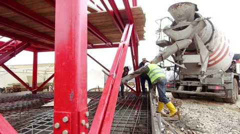 Builder worker pouring concrete into form Stock Footage 62470367