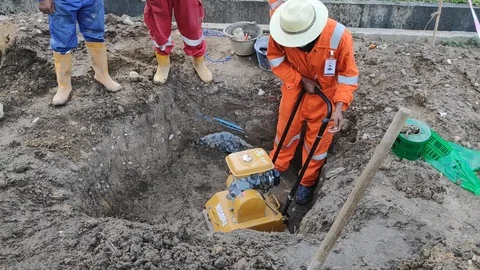 Builder worker at sand ground compaction . Stock Footage 100798224