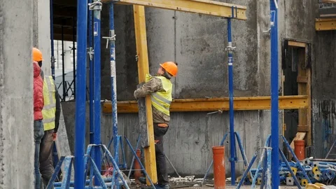 Builder working on construction. Erector Stock-Footage 125924943