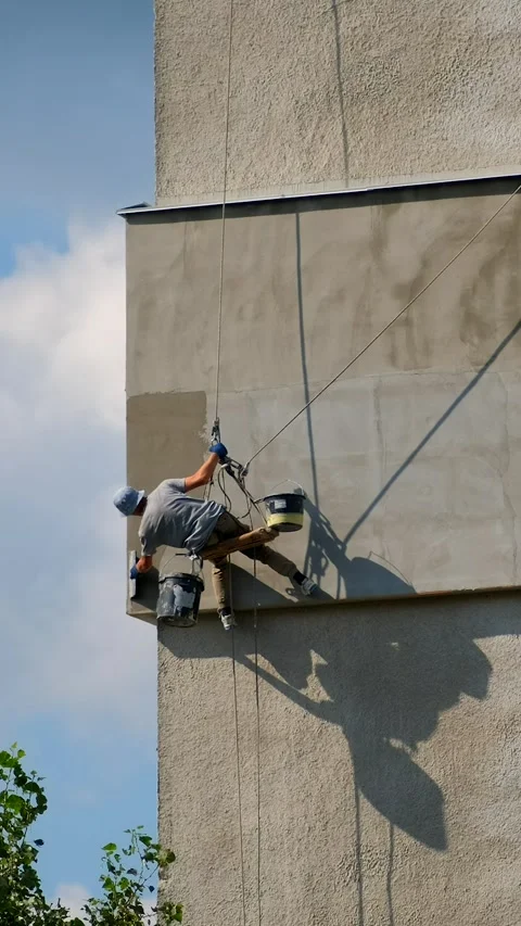 Builder working at height while holding on a rope and insurance. Climber ar.. Stock Footage 306148461