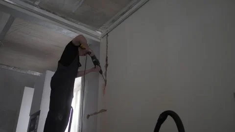 Builder working with rotary hammer drill. Stock Footage 316909606