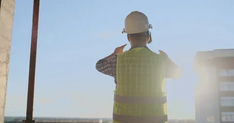 Builder working with VR glasses. Builder projecting with VR glasses future Stock Footage 112975625