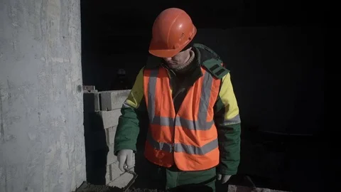 Builder works and talks to the employee Stock Footage 82069186