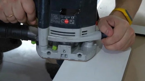 The Builder works with an electric cutter Stock Footage 103949009