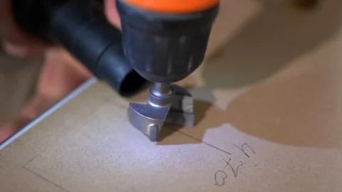 The Builder works with an electric cutter Stock Footage 103949376