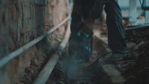 The Builder works with a jackhammer in slow motion Stock Footage 96433348