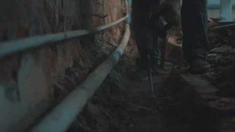 The Builder works with a jackhammer in slow motion Stock Footage 96438777