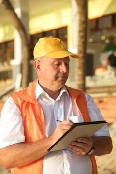 Builder in yellow cap Stock Photos