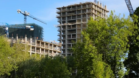 Builders and crane working on the construction of the house Stock Footage 92994097