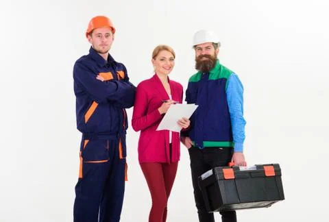 Builders and engineer work together. Men in hard hats Stock Photos