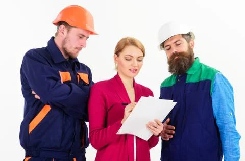 Builders and engineer work together. Female supervisor concept. Stock Photos