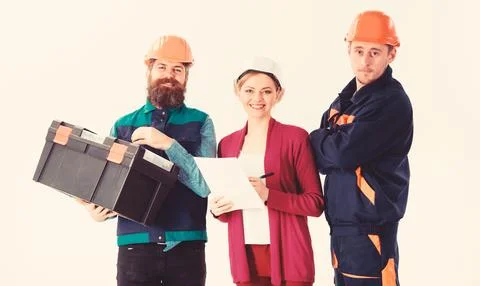Builders and engineer work together. Cheerful team of architects Stock Photos