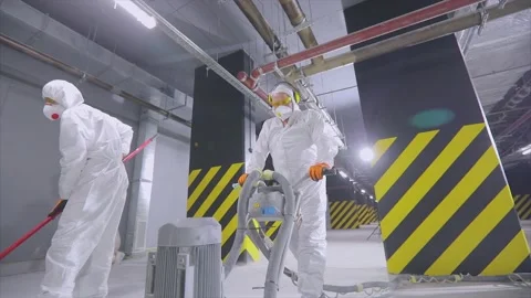 Builders are making a flat floor in the parking lot. Professional builders are Stock-Footage 220934656