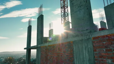 Builders are working on building a house. Construction of a multi-storey Stock Footage 252213280