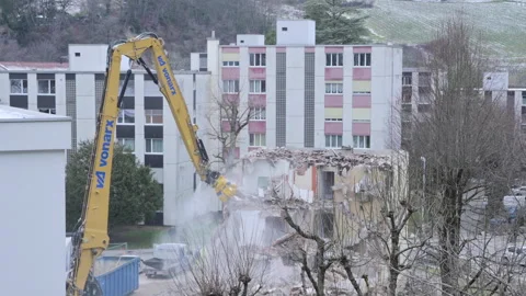 Builders break down an old multi-storey residential building. Construction Video stock 244746786