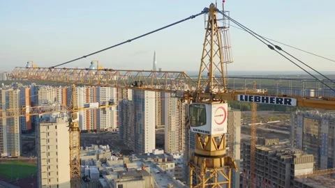 Builders in bright vests and helmets are building a house. monolithic house Stock Footage 132050291