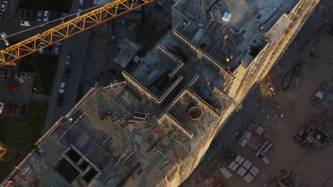 Builders in bright vests and helmets are building a house. Aerial view Stock Footage 132051291