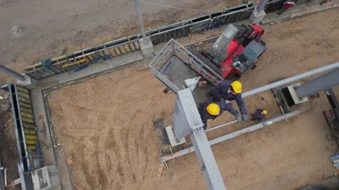 Builders build a modern metal frame roof. drone view Video stock 172129209