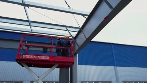Builders build a modern metal frame roof. drone view Stock Footage 172129284