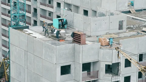 Builders build a multi-storey house Stock Footage 88969690