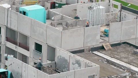 Builders build a multi-storey house Stock Footage 88971279