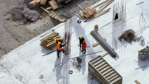 Builders checking a metal structure for durability at a construction site Video stock 236473774