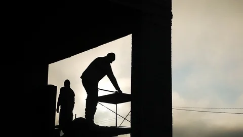 Builders on construction. Silhouette. Work Stock Footage 120481908
