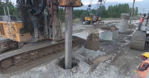 Builders On A Construction Site. Drilling Wells For Bored Piles Stock Footage 75688861
