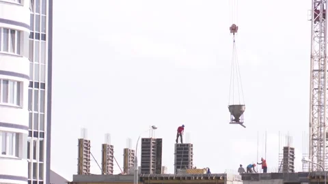 Builders on the construction site erect a monolithic building, reinforced  動画素材 136697653