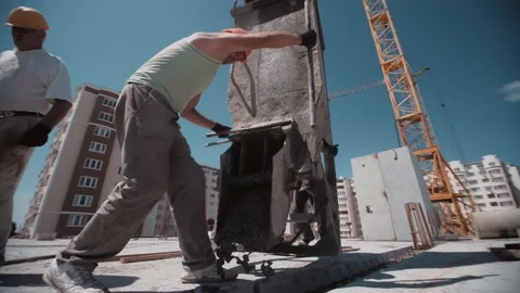 Builders in the construction site fill the cavity with concrete 스톡 동영상 143217296