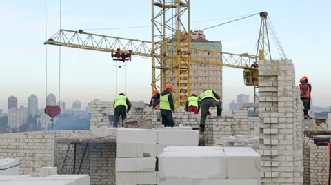 Builders at construction site 스톡 동영상 34353604