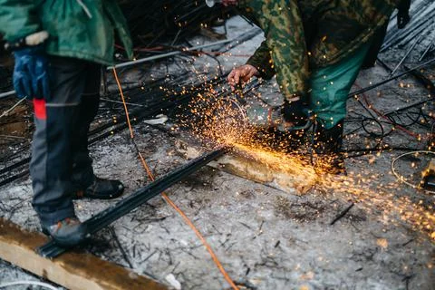 Builders at construction site make engineering calculations and cut materials Stock Photos