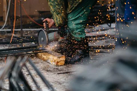 Builders at construction site make engineering calculations and cut materials Stock Photos
