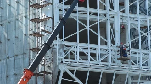Builders in the cradle, build a building Stock Footage 52370741