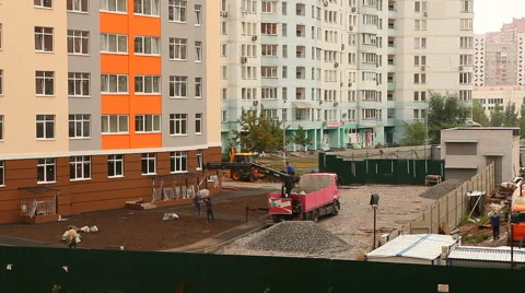 Builders do yard design from stones near new building Stock Footage 66359479