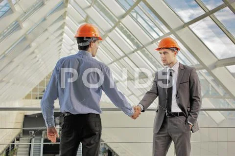 The builders (engineers) discuss the new project Stock Photos