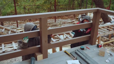 Builders of a frame house, construction of a wooden house Stock Footage 346990286