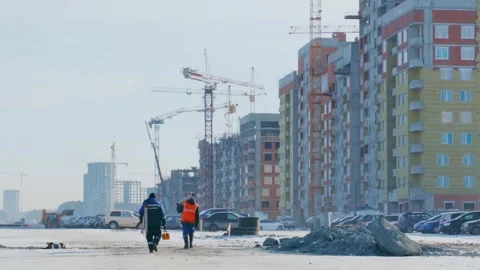Builders going to construction site Stock Footage 258853596