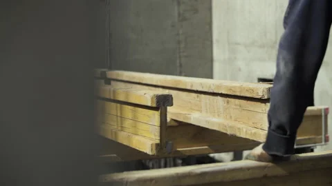 Builders install beams for formwork Stock Footage 255059975