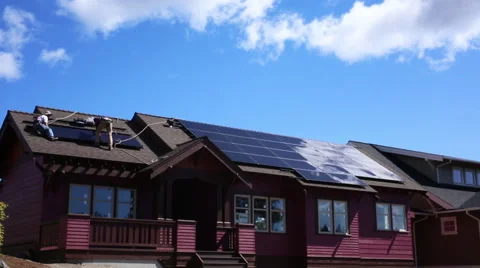 BUILDERS INSTALL SOLAR PANELS ON ZERO NET ENERGY HOME Stock Footage 52550407