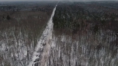 The builders lay the pipe for the intake of oil Stock Footage 124627909