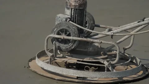 Builders leveling the concrete base Stock Footage 300867462