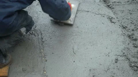 Builders leveling the concrete base Stock Footage 300871370