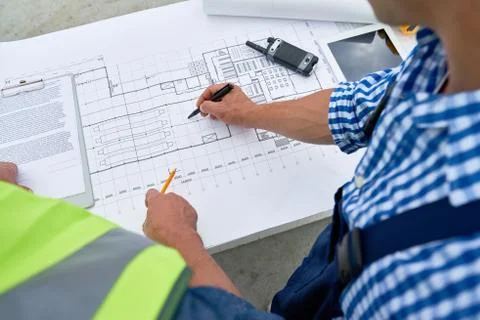 Builders Looking at  Floor Plans 写真素材