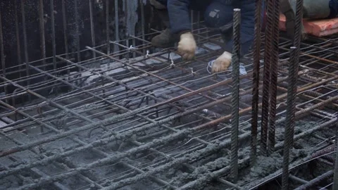 Builders make reinforcement mesh Stock Footage 163566885